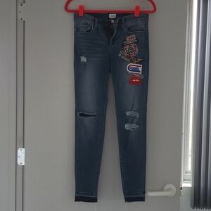 Sneak Peek jeans with patches.